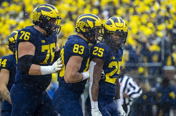 Roman Wilson (14), Ryan Hayes (76), Erick All (83), and Hassan Haskins (25)