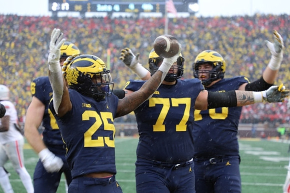 Luke Schoonmaker (86), Hassan Haskins (25), Trevor Keegan (77), and Ryan Hayes (76)