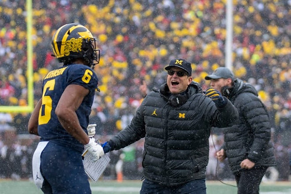 Cornelius Johnson (6) and Jim Harbaugh