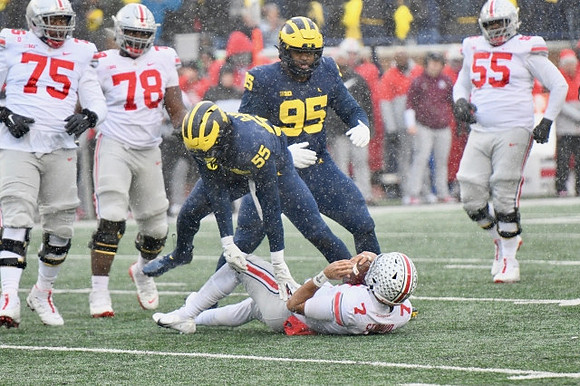 David Ojabo (55) and Donovan Jeter (95)