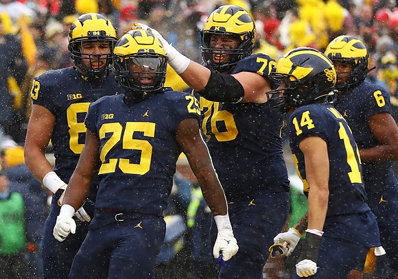 Erick All (83), Hassan Haskins (25), Ryan Hayes (76), Roman Wilson (14), and Cornelius Johnson (6)