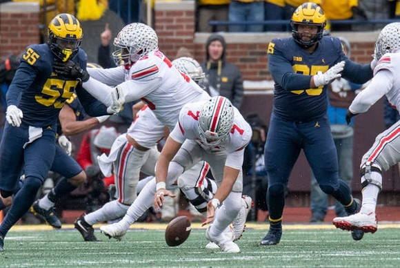 David Ojabo (55) and Donovan Jeter (95)