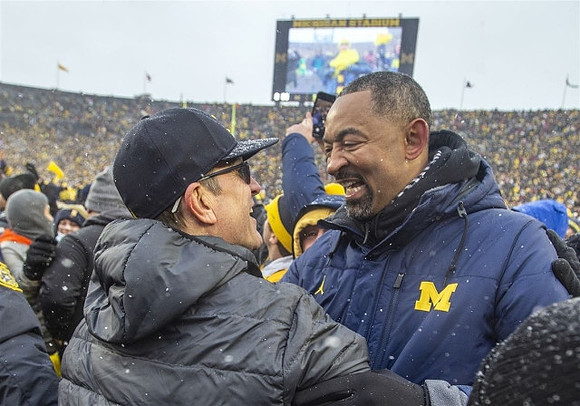 Jim Harbaugh and Juwan Howard