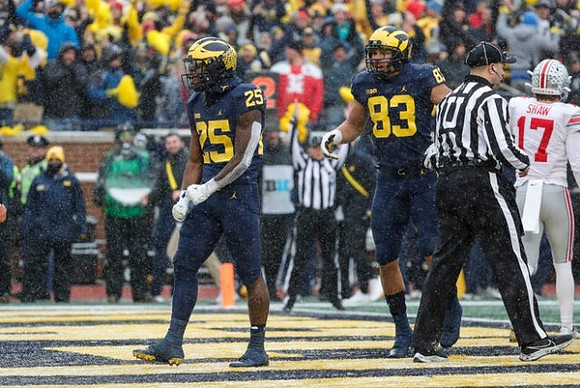 Hassan Haskins (25) and Erick All (83)
