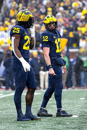Hassan Haskins (25) and Cade McNamara (12)