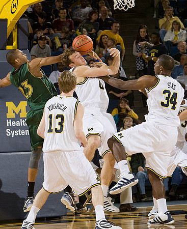 Matt Vogrich (13), Zack Novak (0), and DeShawn Sims (34)
