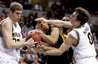 Zack Gibson (32), Zack Novak (0), and Manny Harris (3)