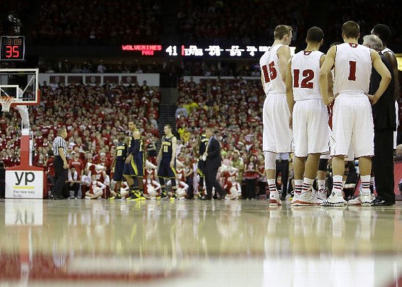 Derrick Walton Jr. (10), Jordan Morgan (52), and Nik Stauskas (11)