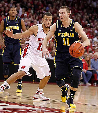 Glenn Robinson III (1) and Nik Stauskas (11)