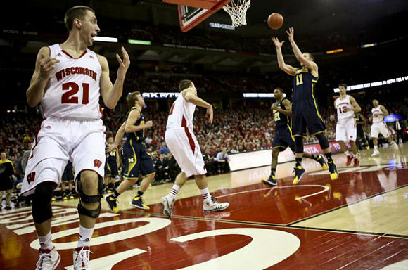 Spike Albrecht (2), Zak Irvin (21), and Nik Stauskas (11)