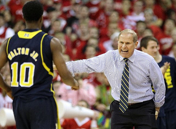 Derrick Walton Jr. (10) and John Beilein