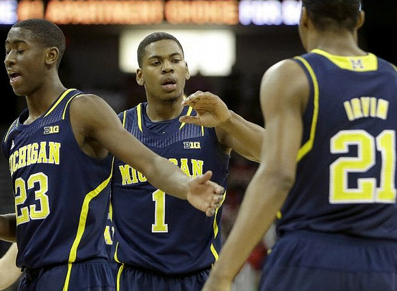 Caris LeVert (23), Glenn Robinson III (1), and Zak Irvin (21)