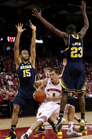 Jon Horford (15), Spike Albrecht (2), and Caris LeVert (23)