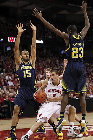 Jon Horford (15), Spike Albrecht (2), and Caris LeVert (23)