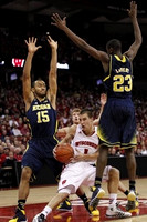 Jon Horford (15) and Caris LeVert (23)
