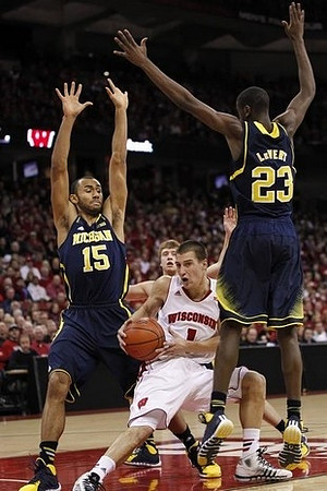 Jon Horford (15) and Caris LeVert (23)