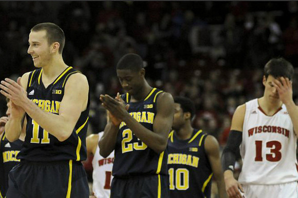 Nik Stauskas (11), Caris LeVert (23), and Derrick Walton Jr. (10)