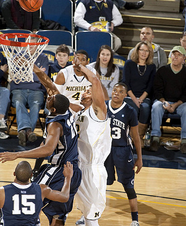 Darius Morris (4) and Jordan Morgan (52)