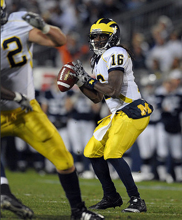 Mark Huyge (72) and Denard Robinson (16)