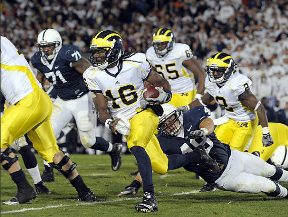 Denard Robinson (16), Patrick Omameh (65), and Vincent Smith (2)