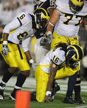 Je'Ron Stokes (6), Denard Robinson (16), and Taylor Lewan (77)