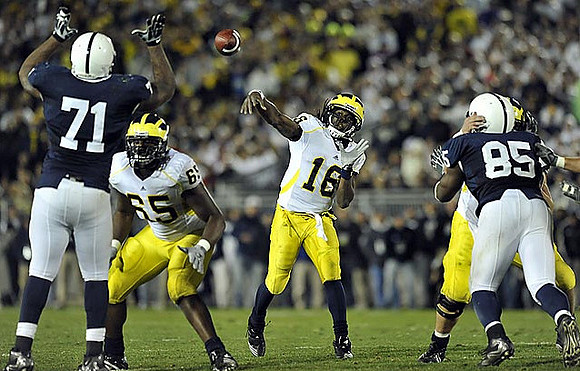 Patrick Omameh (65) and Denard Robinson (16)