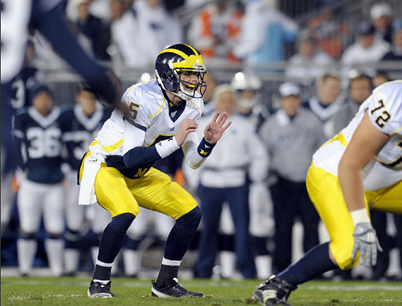 Tate Forcier (5) and Mark Huyge (72)