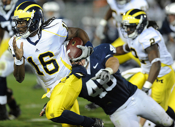 Denard Robinson (16) and Vincent Smith (2)
