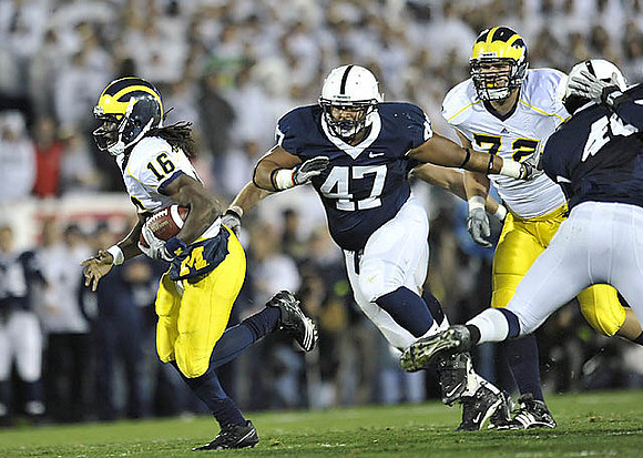 Denard Robinson (16) and Mark Huyge (72)