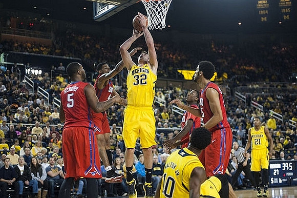 Ricky Doyle (32), Derrick Walton Jr. (10), and Zak Irvin (21)