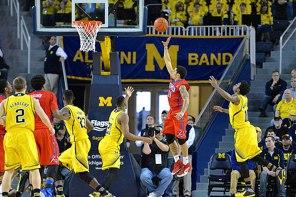 Spike Albrecht (2), Caris LeVert (23), Zak Irvin (21), and Derrick Walton Jr. (10)