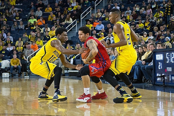 Derrick Walton Jr. (10) and Zak Irvin (21)