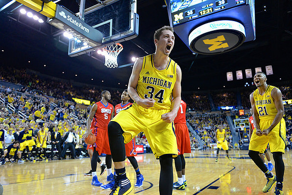 Mark Donnal (34), Zak Irvin (21), and Caris LeVert (23)