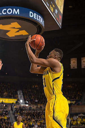 Zak Irvin (21) and Caris LeVert (23)