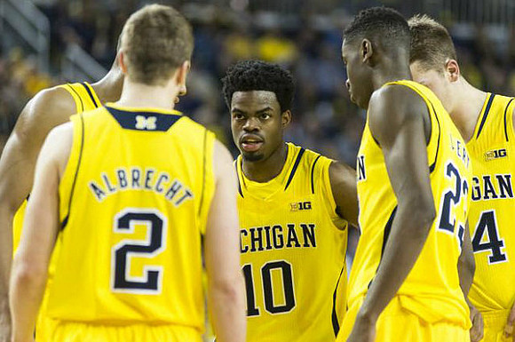 Spike Albrecht (2), Derrick Walton Jr. (10), Caris LeVert (23), and Mark Donnal (34)