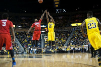 Derrick Walton Jr. (10) and Caris LeVert (23)
