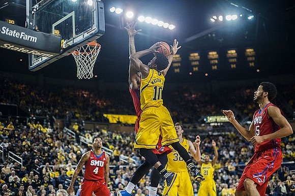 Derrick Walton Jr. (10), Ricky Doyle (32), and Zak Irvin (21)