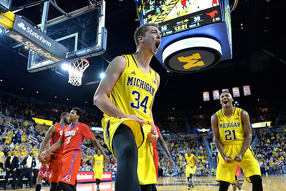 Mark Donnal (34), Zak Irvin (21), Derrick Walton Jr. (10), and Caris LeVert (23)