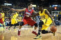 Kameron Chatman (3), Derrick Walton Jr. (10), and Caris LeVert (23)