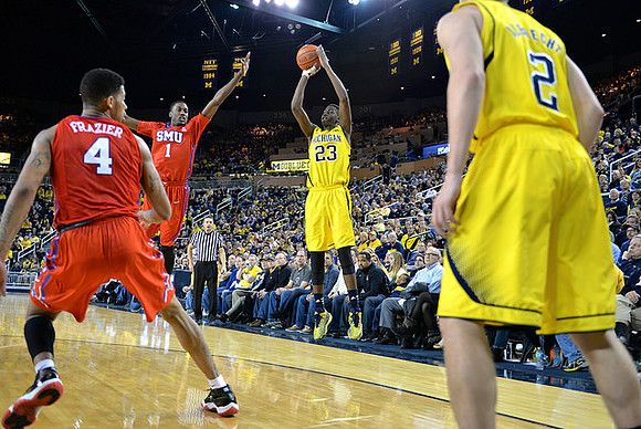 Caris LeVert (23) and Spike Albrecht (2)