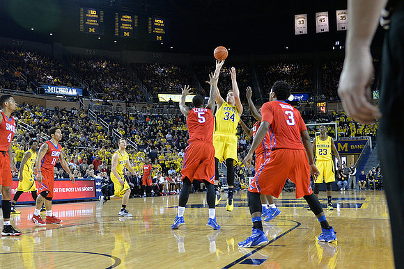 Derrick Walton Jr. (10), Spike Albrecht (2), Mark Donnal (34), and Caris LeVert (23)
