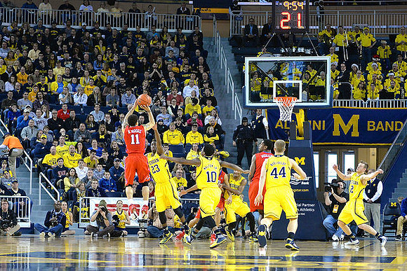 Caris LeVert (23), Derrick Walton Jr. (10), Max Bielfeldt (44), and Spike Albrecht (2)