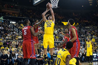 Ricky Doyle (32), Derrick Walton Jr. (10), and Zak Irvin (21)