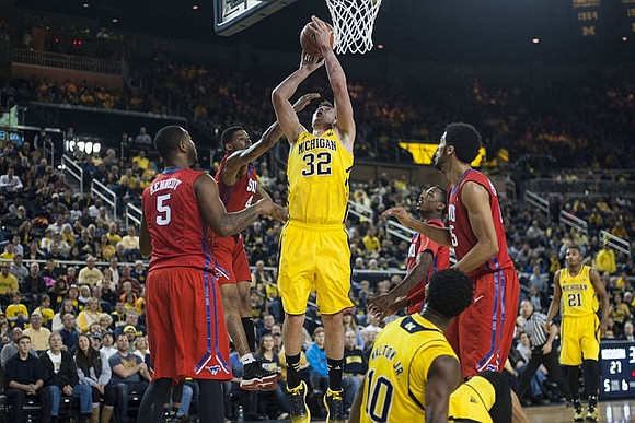 Ricky Doyle (32), Derrick Walton Jr. (10), and Zak Irvin (21)