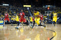 Derrick Walton Jr. (10), Zak Irvin (21), and Caris LeVert (23)