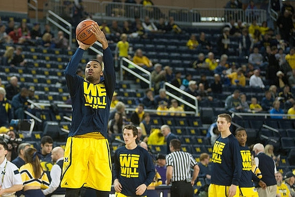 Zak Irvin (21), Andrew Dakich (11), and Mark Donnal (34)