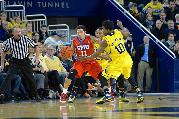 Derrick Walton Jr. (10) and Zak Irvin (21)