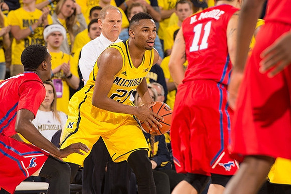 Zak Irvin (21) and John Beilein