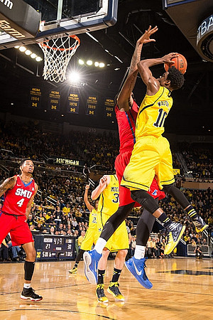 Aubrey Dawkins (24), Ricky Doyle (32), and Derrick Walton Jr. (10)