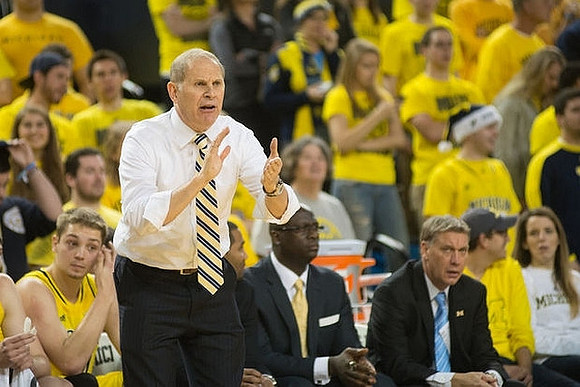 Mark Donnal (34), John Beilein, Bacari Alexander, and Jeff Meyer